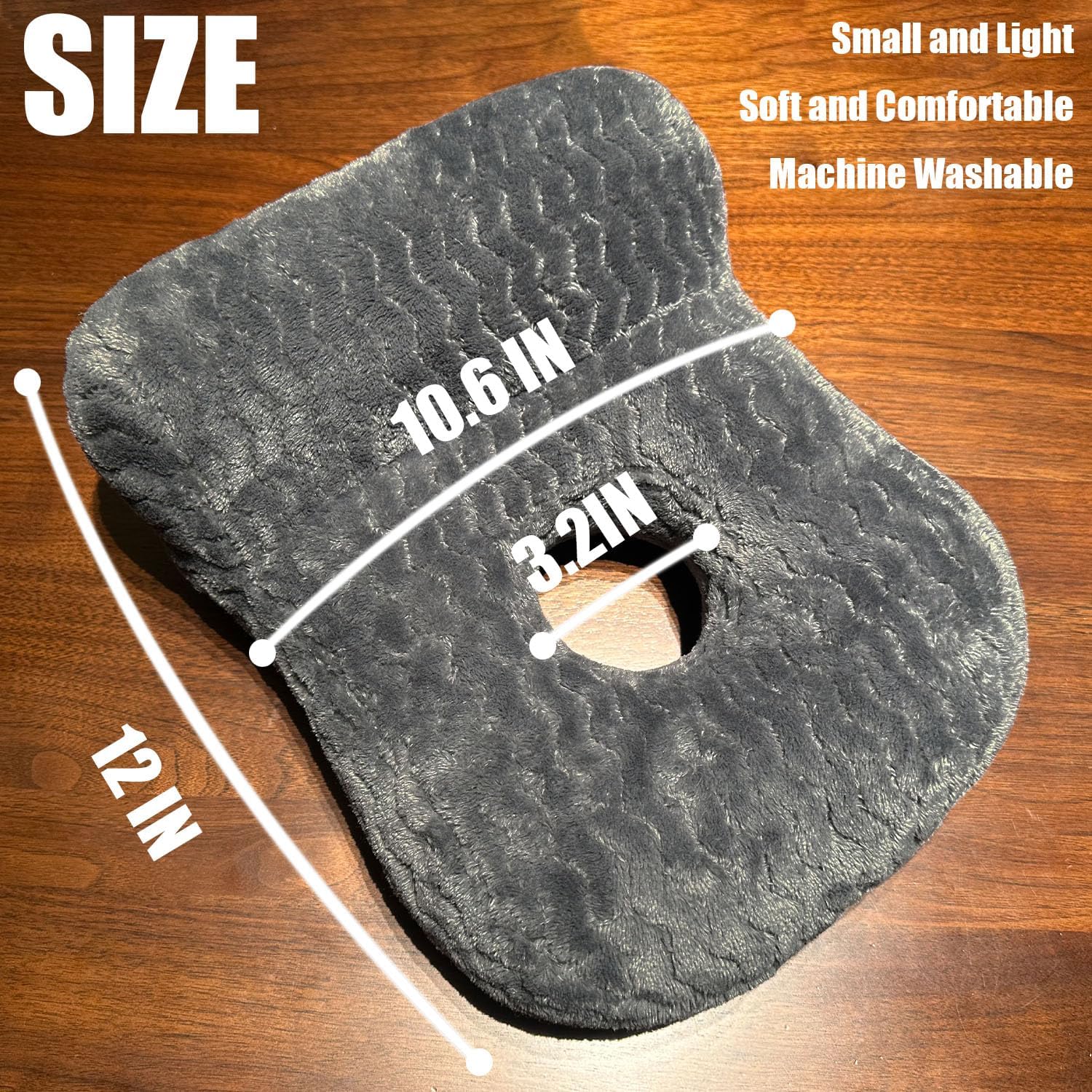 A dark gray contoured seat cushion shown on a wooden surface with overlaid size measurements: 12 IN overall, 10.6 IN width, and 3.